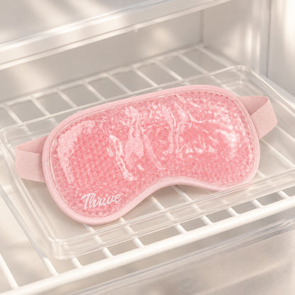 Pink gel bead eye mask chilling on a refrigerator shelf – thumbnail